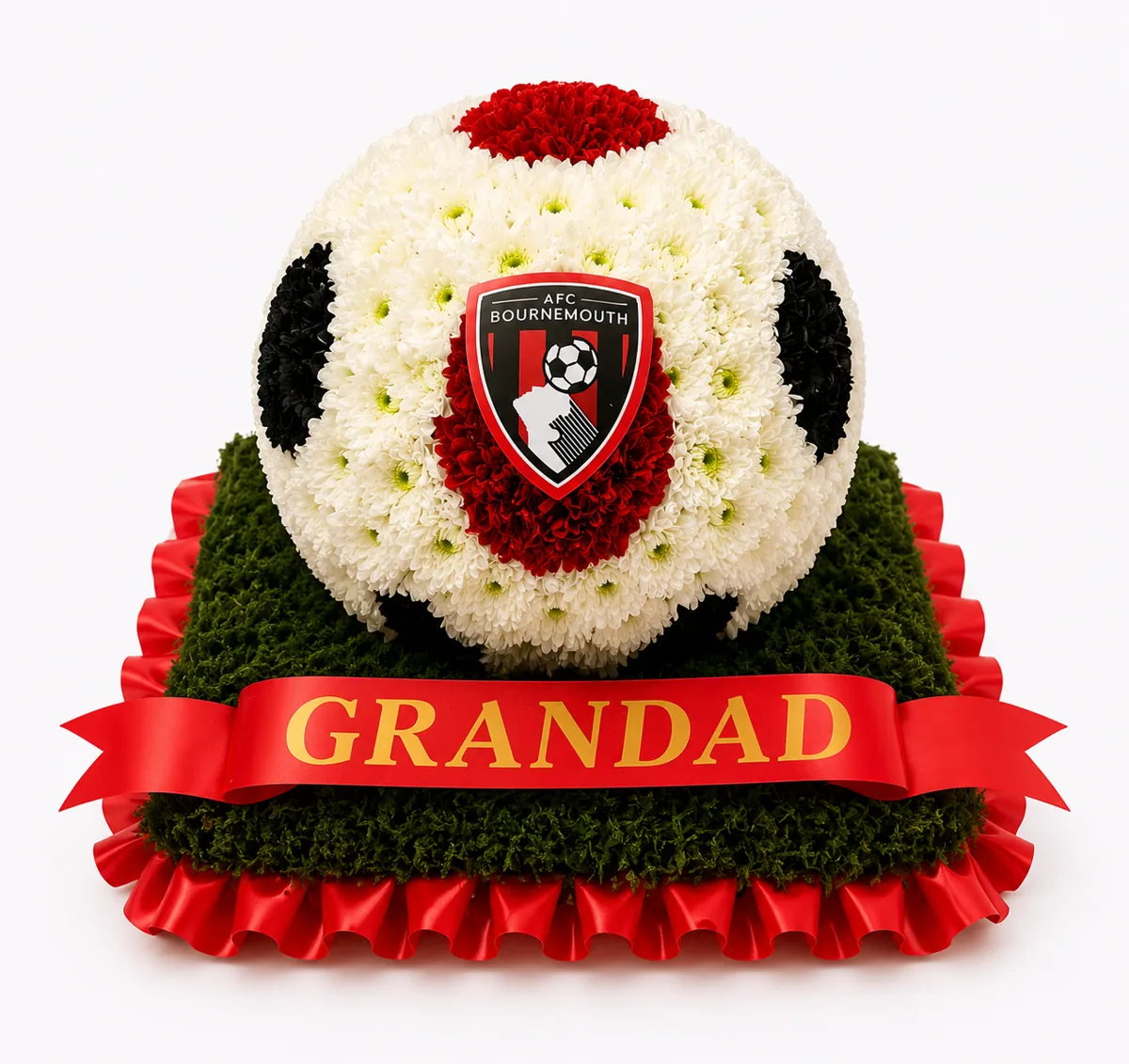 Football-themed funeral tribute with GRANDAD ribbon