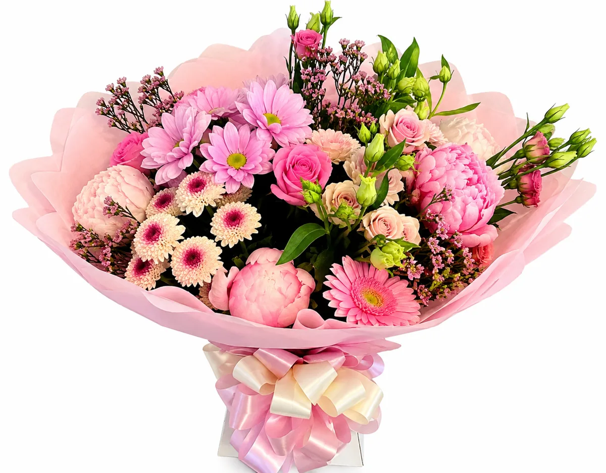 Soft pink bouquet with peonies, gerberas and roses tied with ribbon