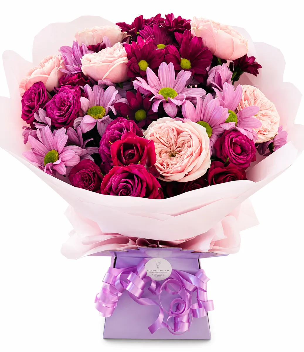 Pink and plum bouquet with roses and chrysanthemums in a lilac gift box
